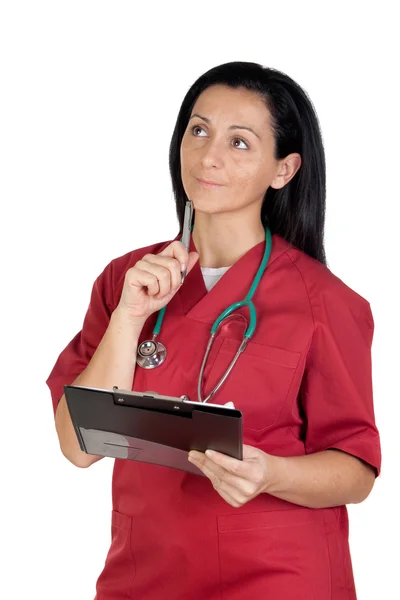 Happy doctor woman with clipboard thinking — Stock Photo, Image