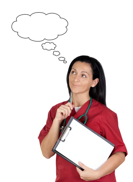Happy doctor woman with clipboard in blank thinking — Stock Photo, Image