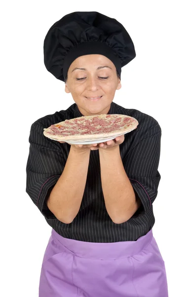Pretty cook woman smelling ham pizza — Stock Photo, Image