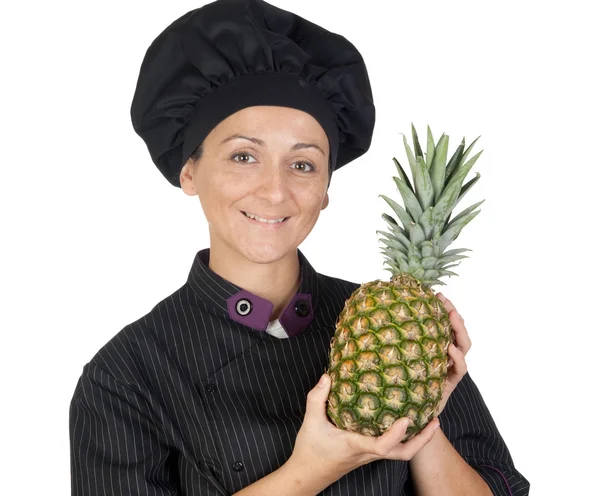 Mulher cozinheira bonita com abacaxi — Fotografia de Stock