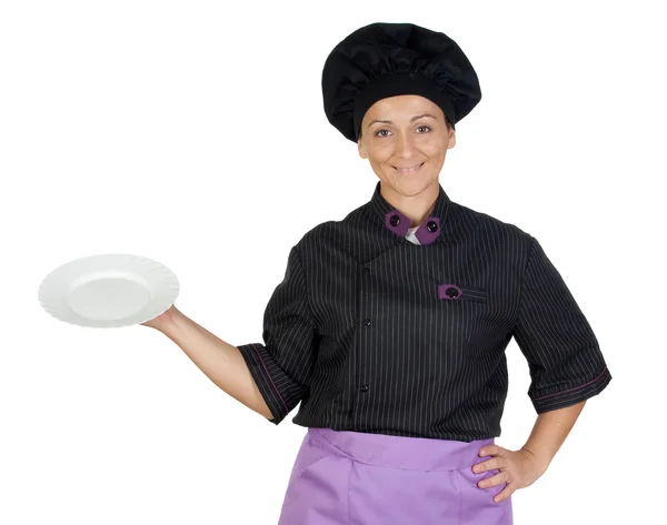 Docela vařit žena s černou uniformu — Stock fotografie