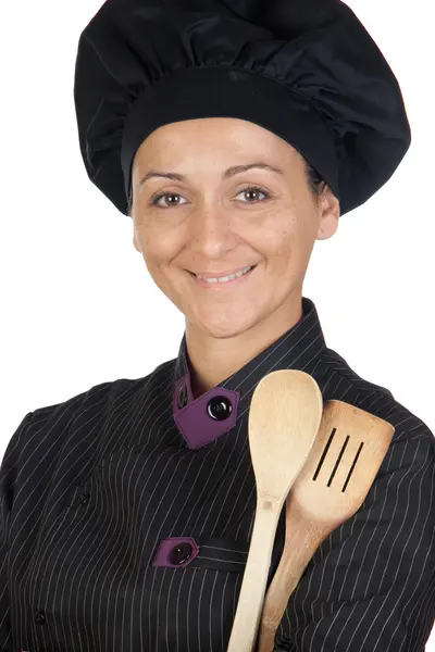 Jolie cuisinière avec ustensiles de cuisine en bois — Photo