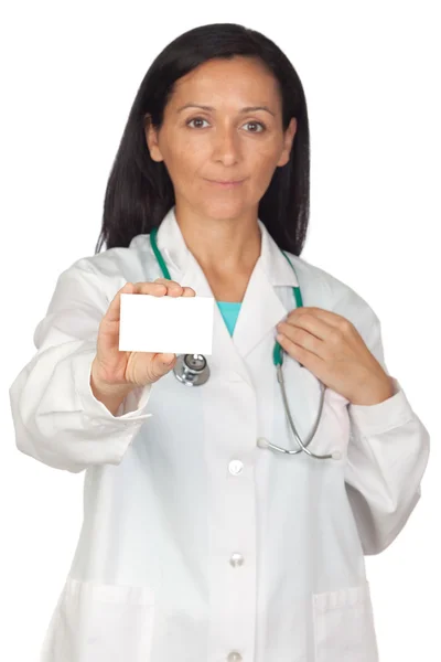 Brunette doctor with a blank card (Focus on card) — Stock Photo, Image