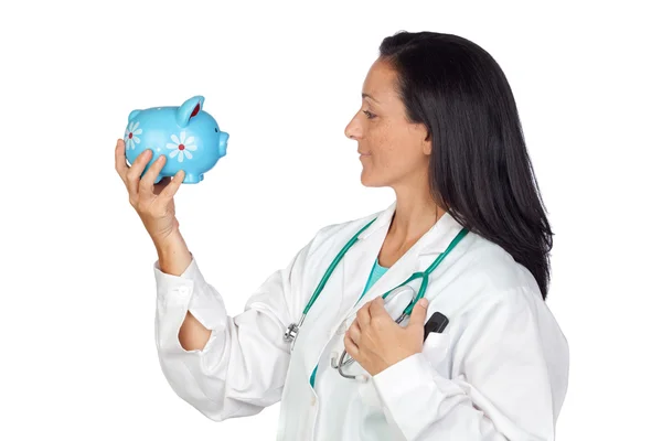 Adorable doctor with money-box — Stock Photo, Image