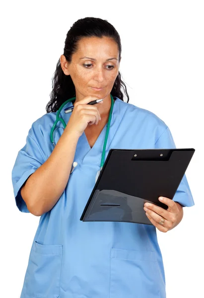 Happy doctor woman with clipboard thinking — Stock Photo, Image