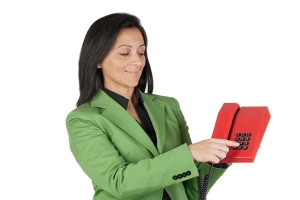 Geschäftsfrau zeigt auf die Tasten am Telefon — Stockfoto