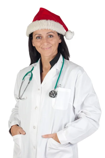 Девушка-доктор в шляпе Санта-Клауса — стоковое фото