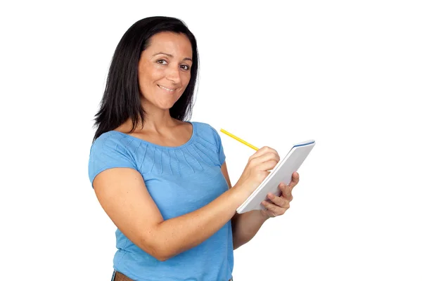 Mujer morena escribiendo en un cuaderno — Foto de Stock