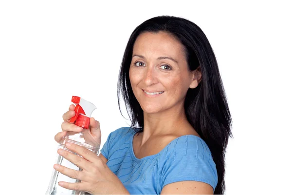 Adorável dona de casa com difusor fazendo limpeza — Fotografia de Stock