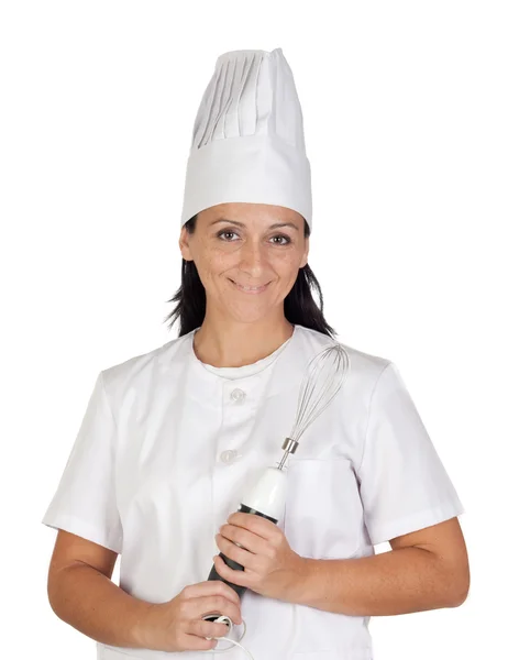 Menina cozinheiro bonita com uma misturadora — Fotografia de Stock