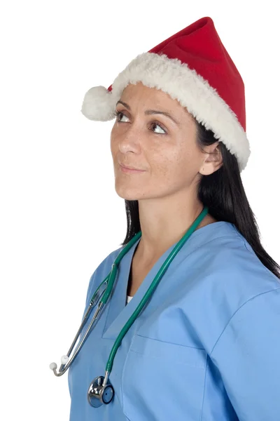 Attractive doctor woman with Christmas cup thinking — Stock Photo, Image