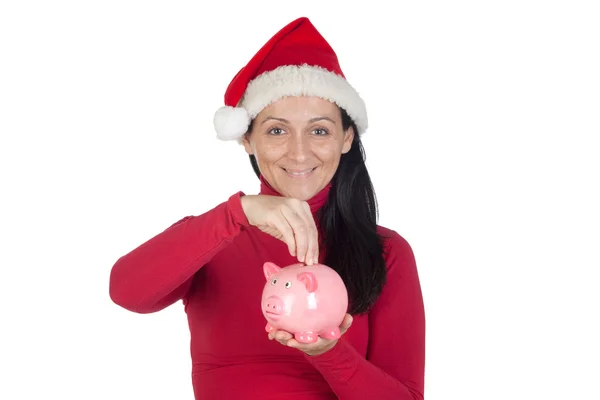 Schönes Mädchen mit Weihnachtsmütze Sparen — Stockfoto