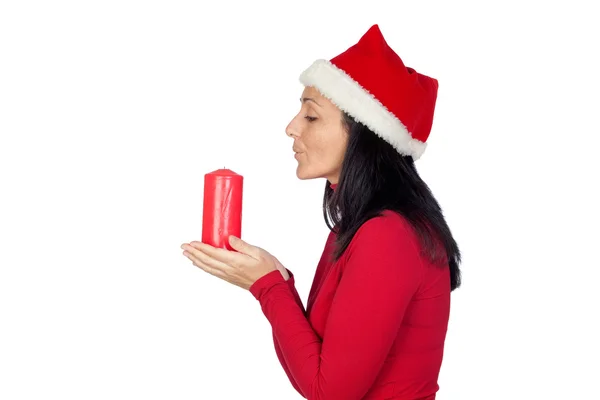 Menina bonita com Natal soprando uma vela — Fotografia de Stock
