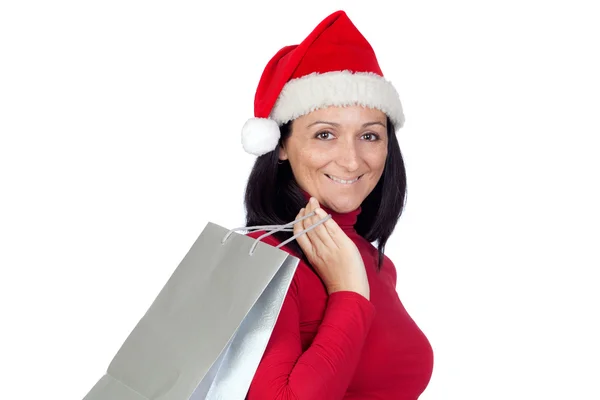 Menina morena com chapéu de Natal vai às compras — Fotografia de Stock
