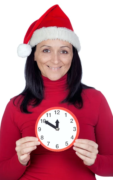 Schönes Mädchen mit Weihnachtsmütze und Uhr — Stockfoto