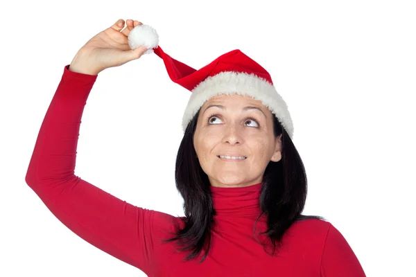 Игривая девушка в рождественской шляпе — стоковое фото
