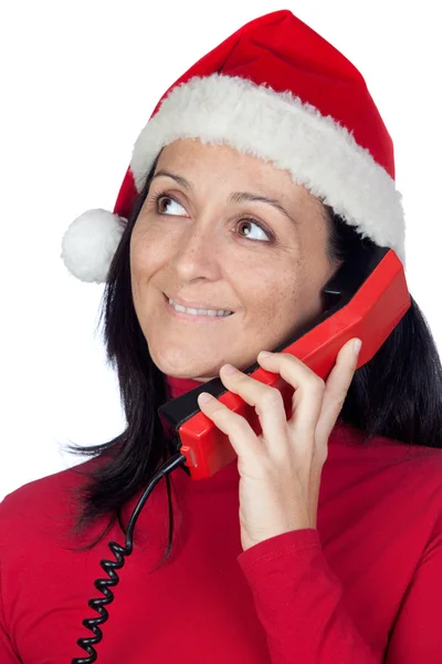 Mooi meisje met kerst hoed naar telefoon — Stockfoto