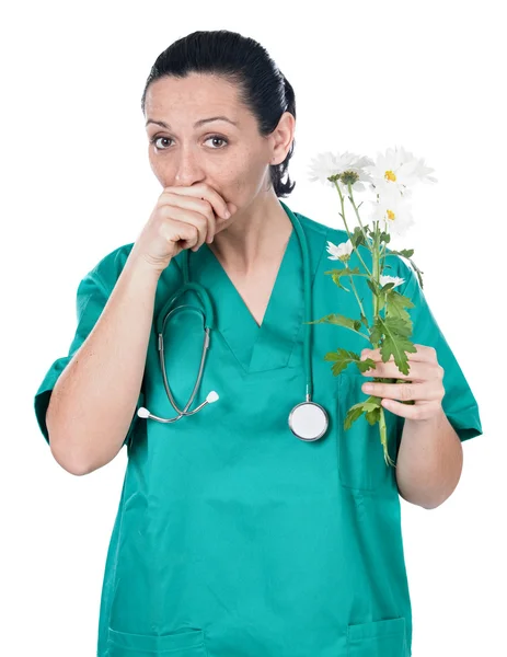 Allergic doctor woman with flowers — Stock Photo, Image