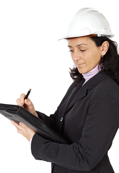 Attractive young person architect taking notes in a folder — Stock Photo, Image