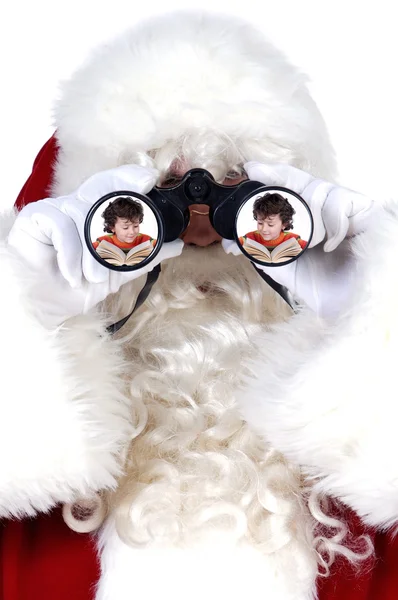 圣诞老人用双筒望远镜 免版税图库图片