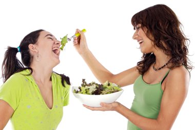 Two beautiful girls with a salad clipart