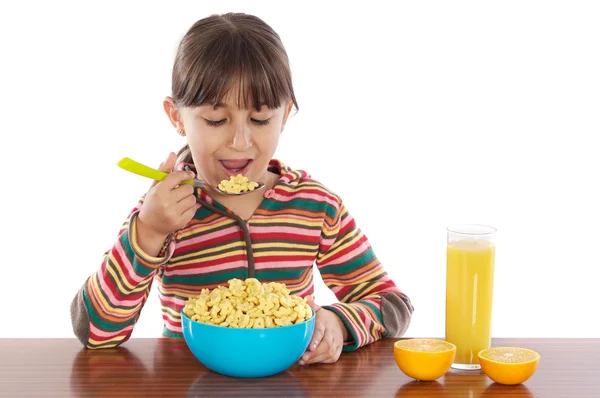 Girl eating breakfast — Stock Photo, Image