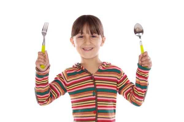 Schattig meisje met vork en lepel klaar voor de lunch — Stockfoto