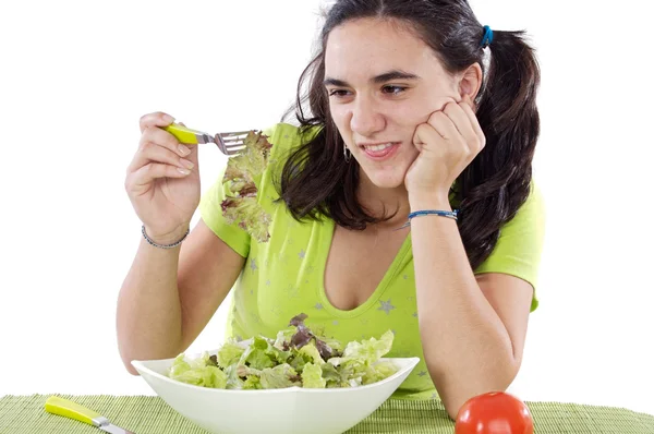 Girl eating salad. I do not like anything! — Stock Photo, Image