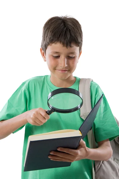Reading with a magnifying glass — Stock Photo, Image