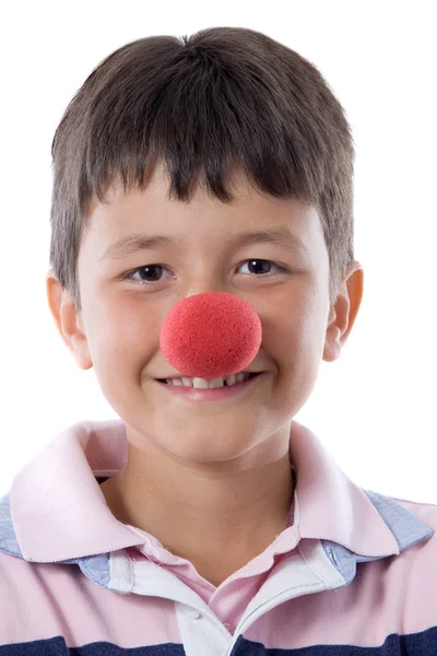 Retrato de uma criança bonita com um nariz de palhaço — Fotografia de Stock