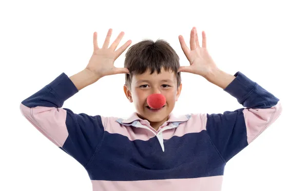 Criança adorável com nariz de palhaço — Fotografia de Stock