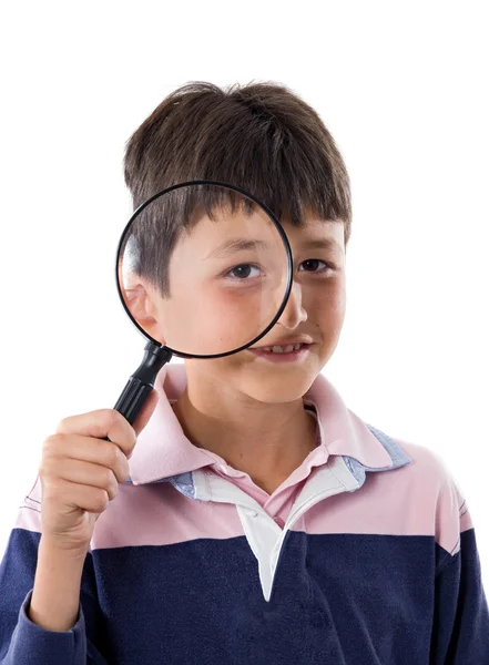 Kid with magnifying glass — Stock Photo, Image