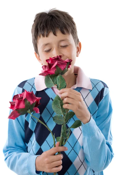 Jongen ruiken een bloem — Stockfoto