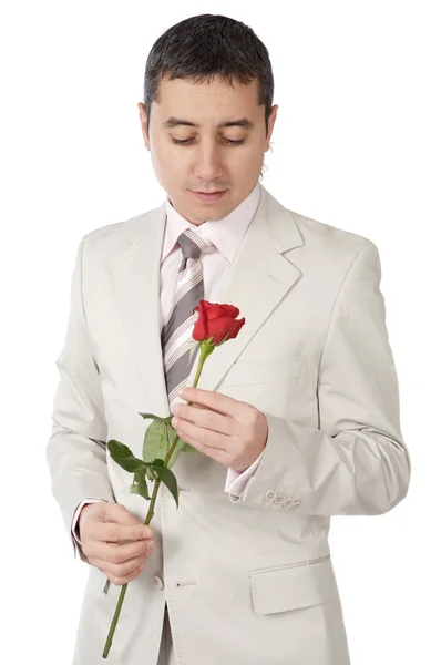 Νεαρό άτομο που είναι ερωτευμένος με ένα τριαντάφυλλο — Φωτογραφία Αρχείου