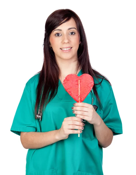 Attractive brunette doctor with a lollipop — Stock Photo, Image