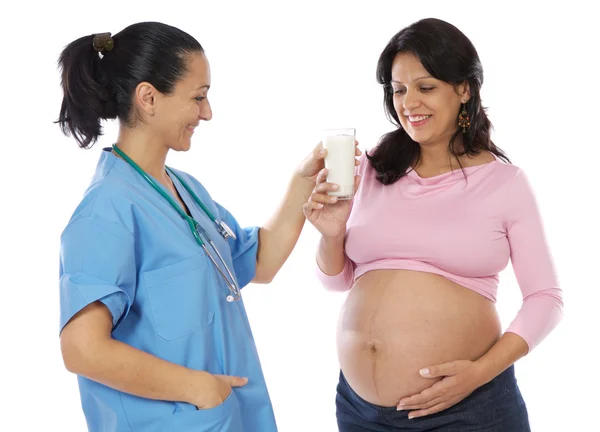Doktor kvinna och vacker gravid — Stockfoto