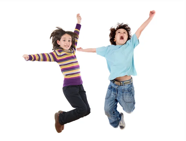 Deux enfants heureux sautant à la fois — Photo