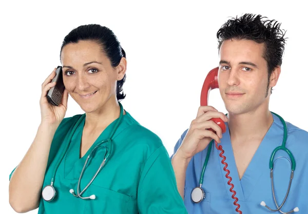 Equipa médica ao telefone — Fotografia de Stock