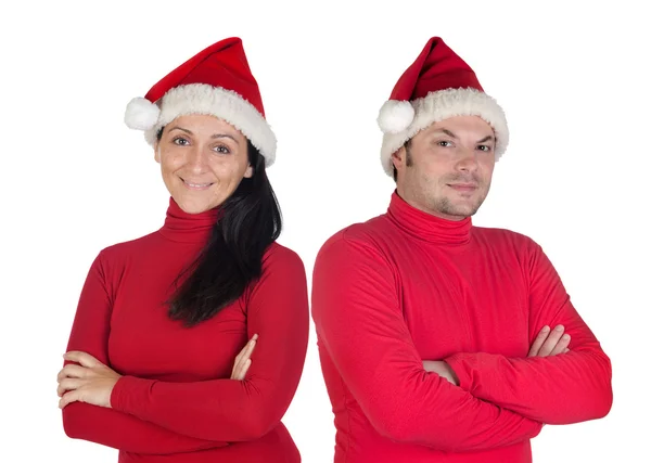 Par med röda kläder i jul — Stockfoto
