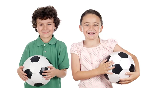 Due adorabili bambini con palloni da calcio — Foto Stock