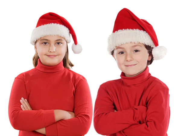 Pareja de niños con sombrero de Navidad — Foto de Stock