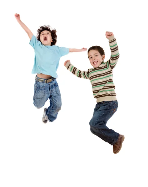Deux enfants heureux sautant à la fois — Photo