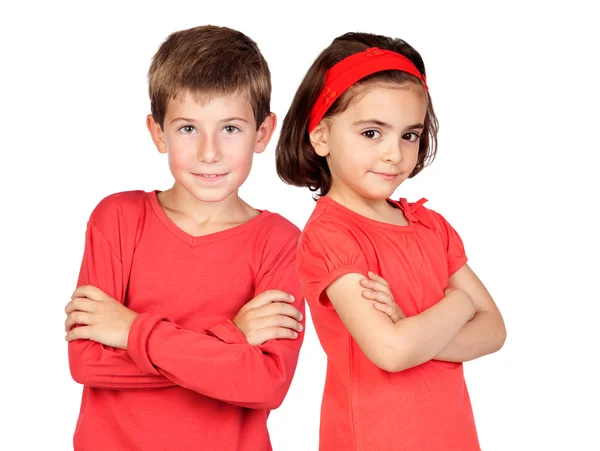 Двое детей в красном — стоковое фото