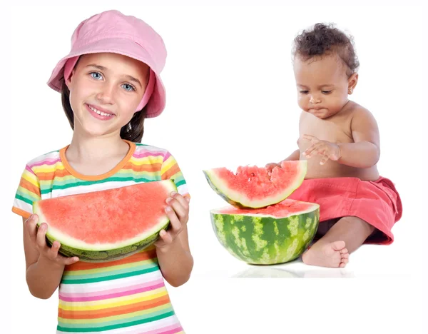 Baby and girl eating watermelon — Stock Photo, Image