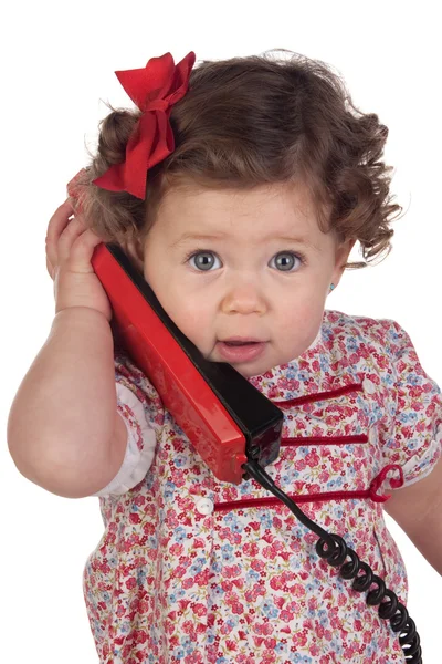 Engraçado bebê menina com telefone vermelho — Fotografia de Stock