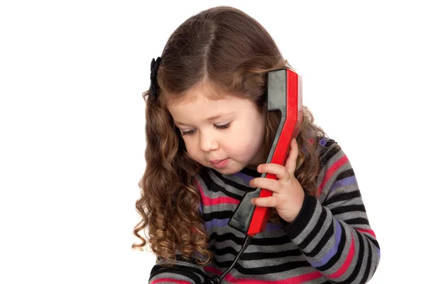 Schattige baby met een rode telefoon — Stockfoto