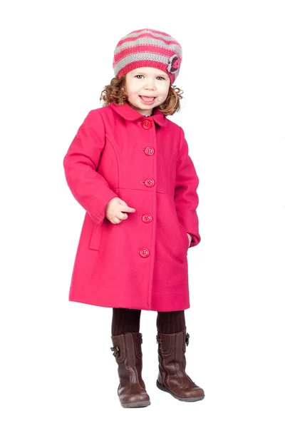 Улыбающаяся девочка в розовом пальто — стоковое фото