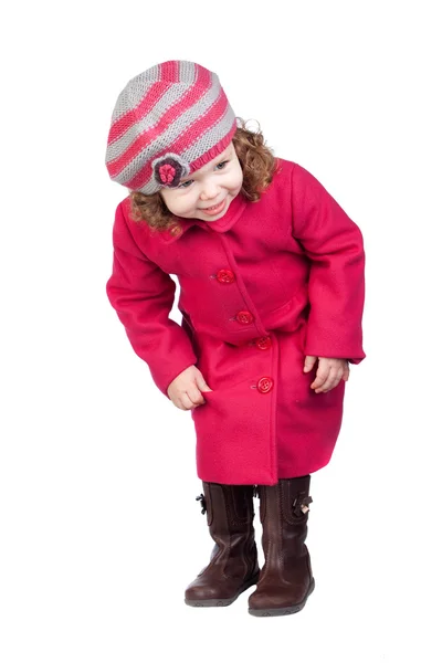 Neugieriges Baby-Mädchen mit rosa Mantel — Stockfoto
