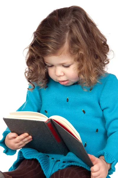 Kitap okuma gülümseyen kız bebek — Stok fotoğraf