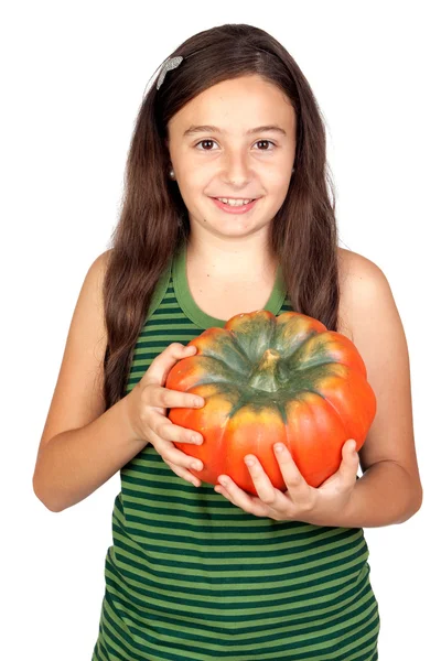 Gelukkig meisje in halloween met een grote pompoen — Stockfoto